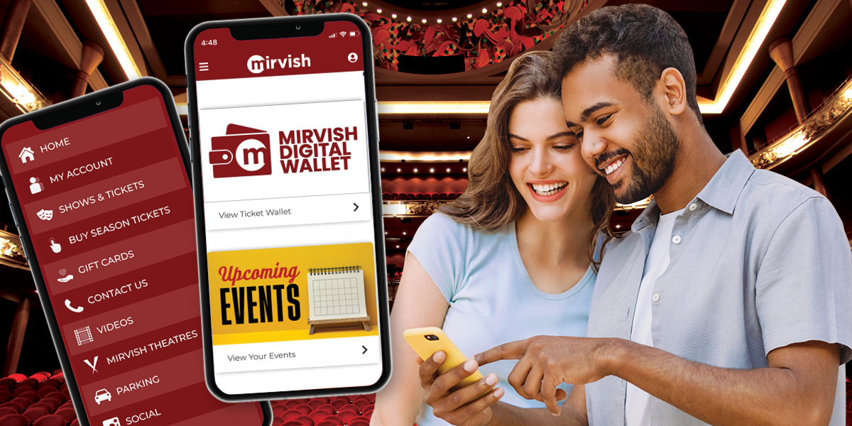 Two people look at the screen of a mobile device